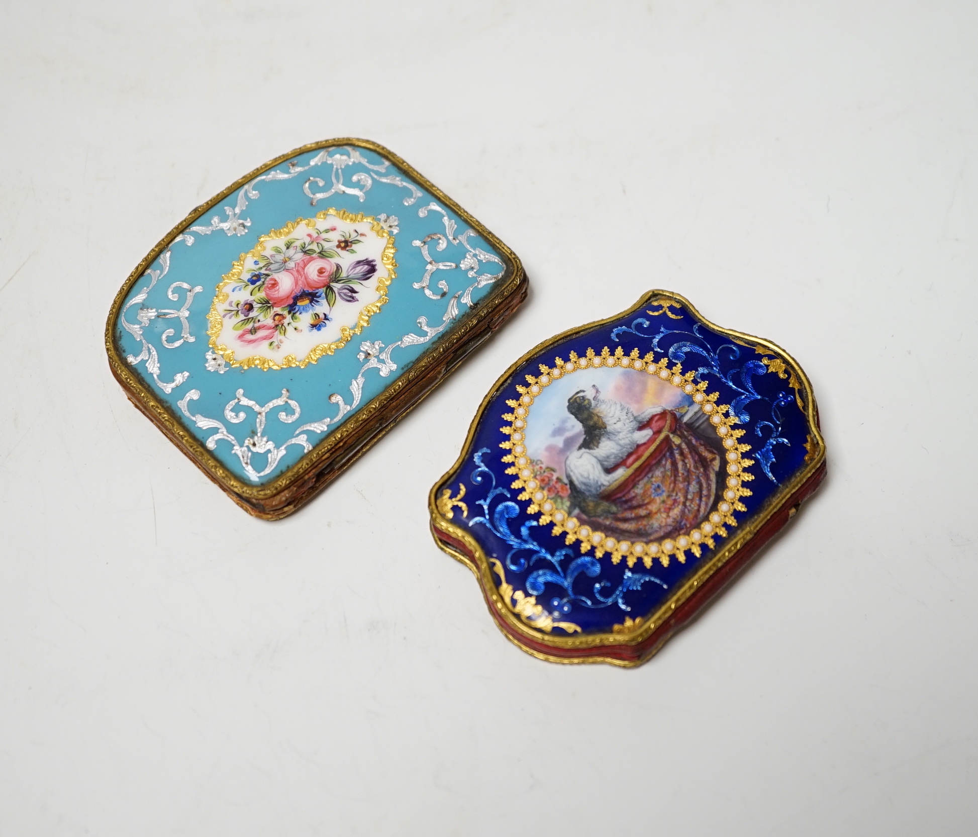 Two 19th century French or Swiss enamelled purses, One finely painted with a spaniel seated on a cushion, the other with a bouquet of flowers